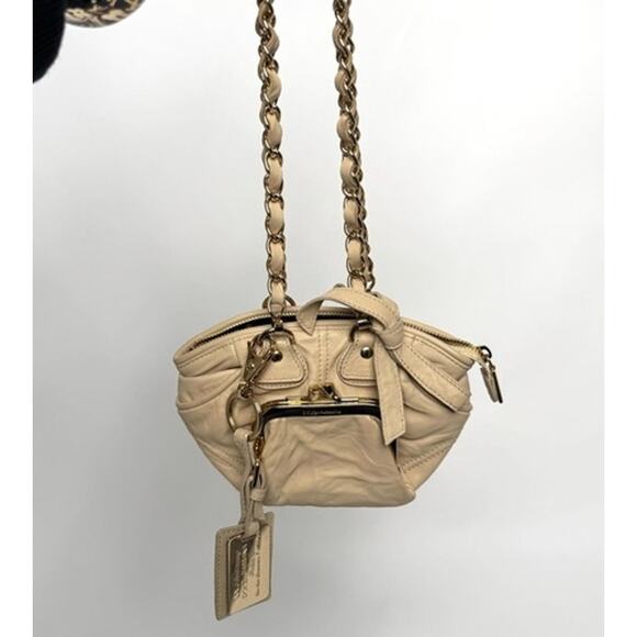 Dolce and Gabbana miniature leather bag with kiss lock plaque and gold hardware